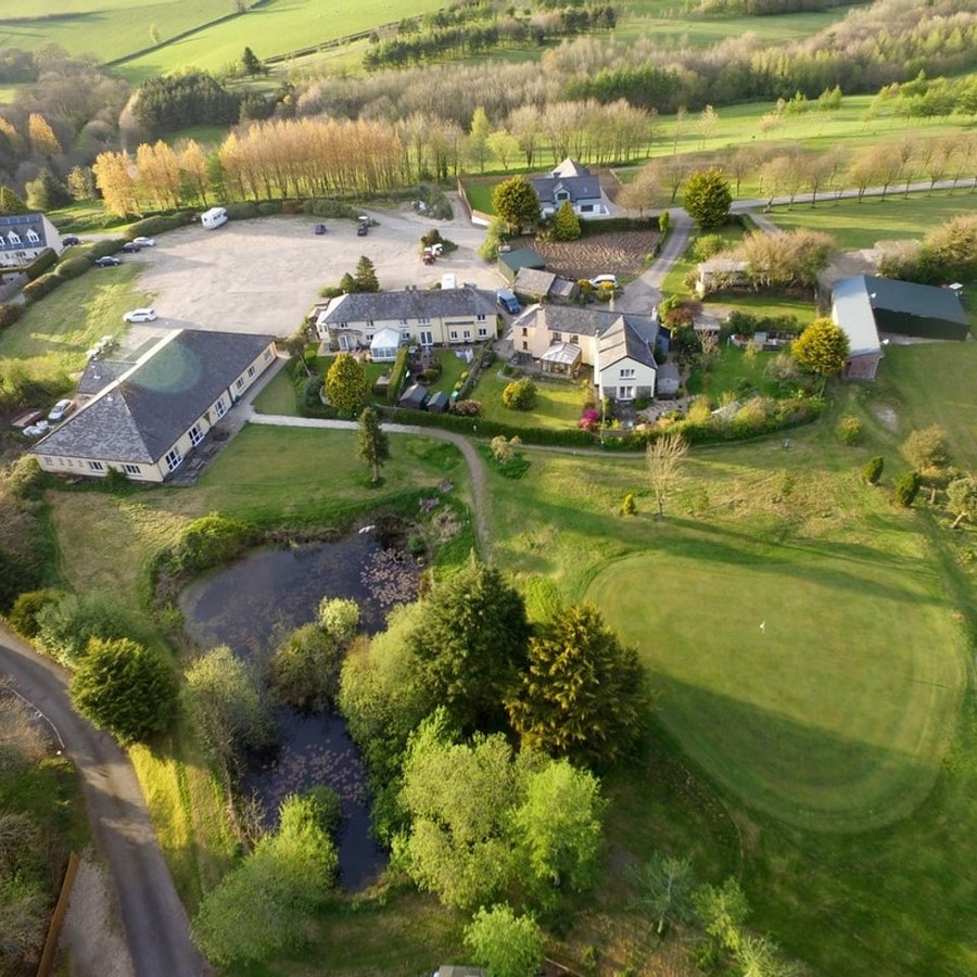 Libbaton Golf Club pond and clubhouse view in North Devon