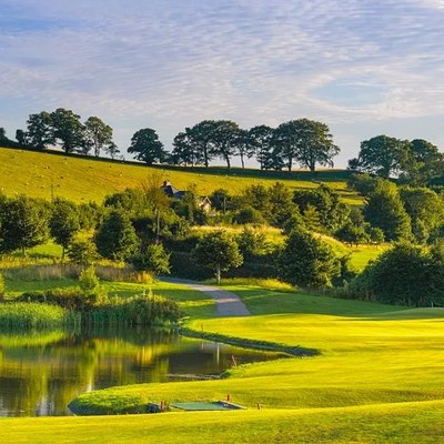 Portmore Golf Park lake and fairway at sunset in North Devon